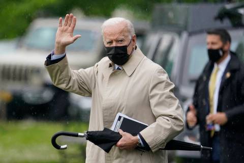 FILE - President Joe Biden waves as he walks to Marine One on the Ellipse near the White House, ...