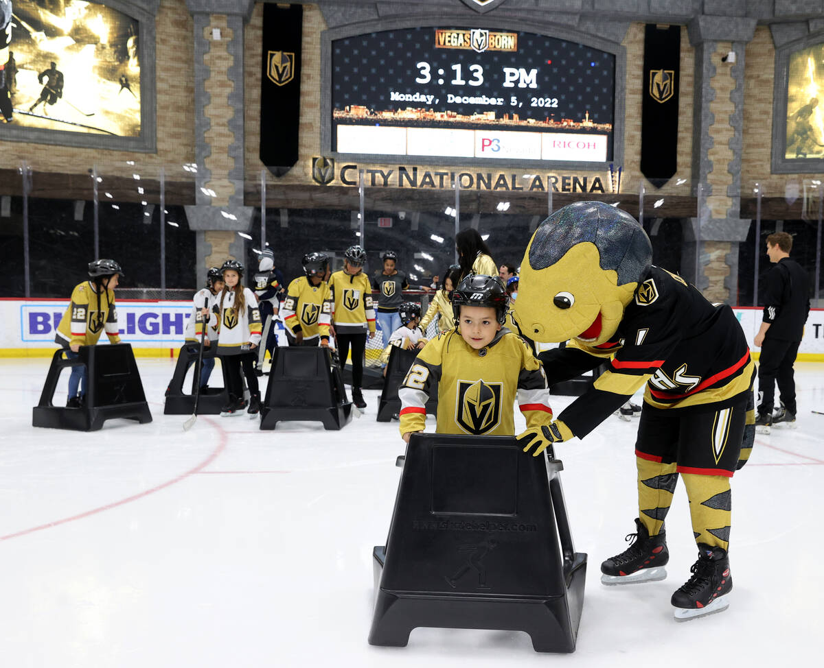 Former UMC Children’s Hospital patient Manolo Avila, 7, skates with the help of Chance t ...
