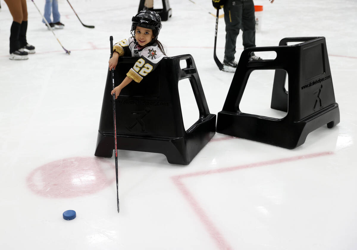 Former UMC Children’s Hospital patient Nanea Castillo, 5, shoots pucks during a Vegas Go ...