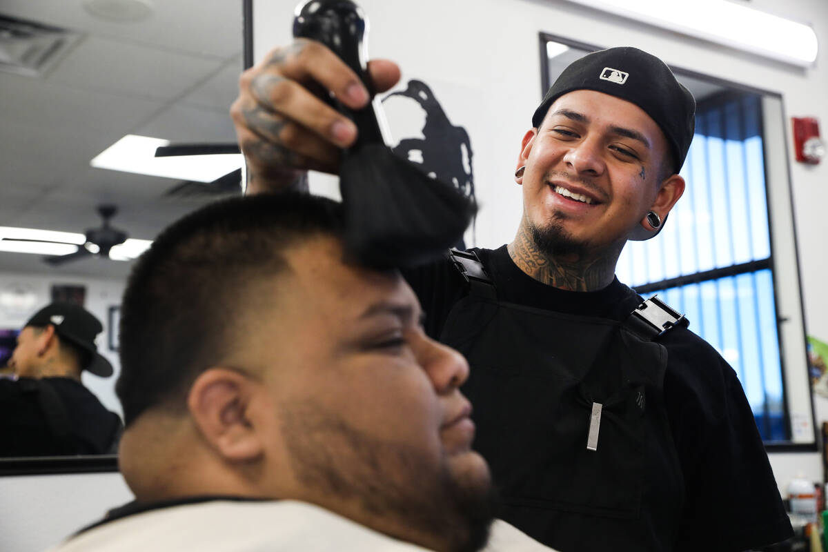 “Easy” Castro cuts the hair of Jesse Servin on Thursday, Feb. 17, 2022 at Icon Barbershop i ...