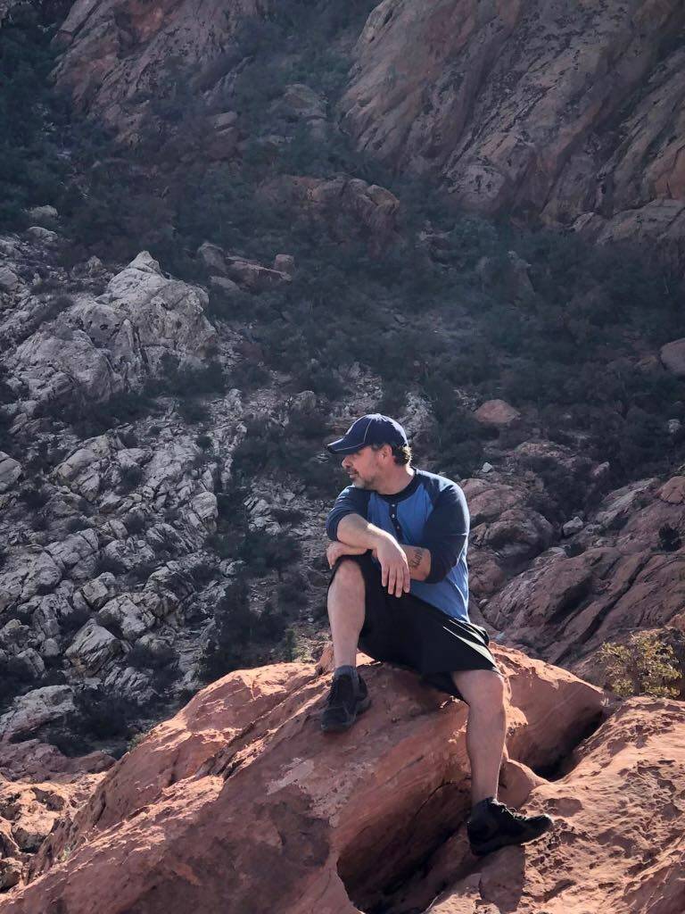Rob Johnson on a hike in Red Rock Canyon National Conservation Area. (Photo courtesy of Briana ...