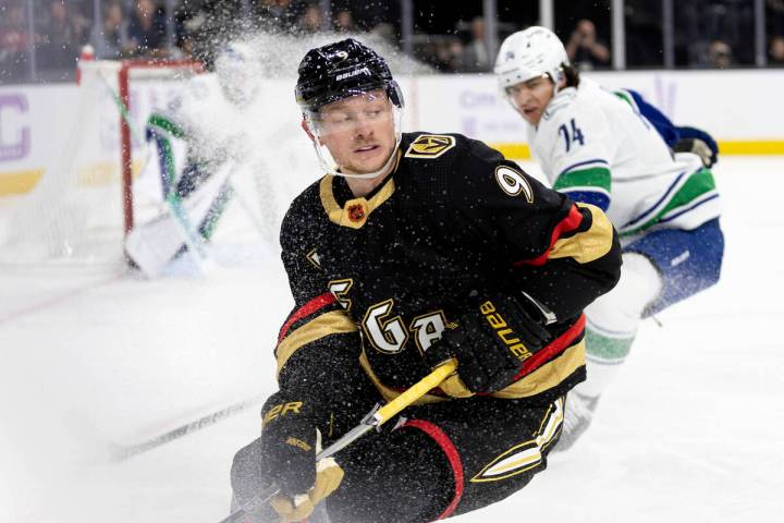 Golden Knights center Jack Eichel (9) stops as the Canucks gain possession of the puck during t ...