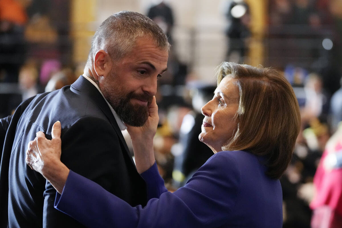 Speaker of the House Nancy Pelosi of Calif., embraces former Washington Metropolitan Police Dep ...