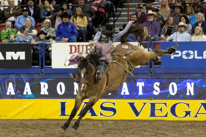 Logan Hay, of Wildwood, Alberta, Canada, competes in saddle bronc riding during the sixth go-ro ...