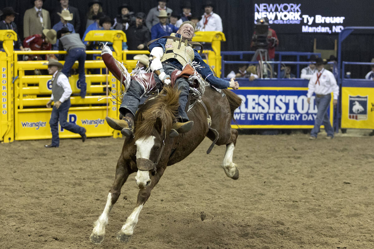 Ty Breuer, of Mandan, N.D., competes in bareback riding during the sixth go-round of the Nation ...
