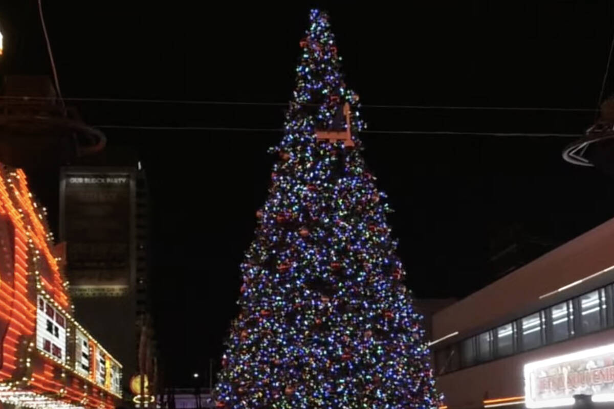 In this image captured from video, the Fremont Street Experience lights its Christmas tree Tues ...