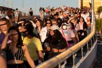 BTS fans, known as the “BTS Army” online, cross West Hacienda Avenue toward Alleg ...