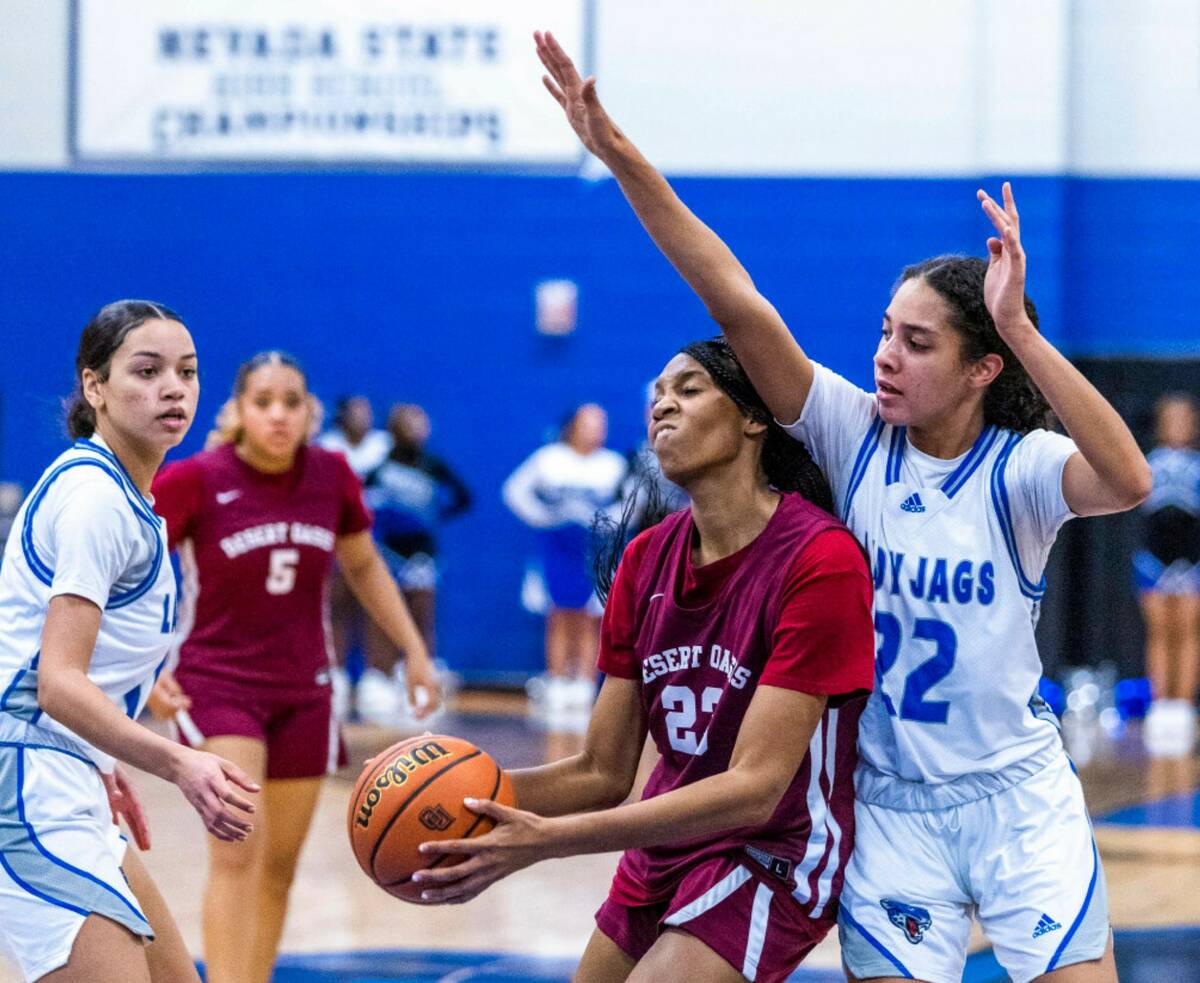 Desert Oasis forward Brooklyn Scurry (23) battles underneath the basket for a shot defended wel ...