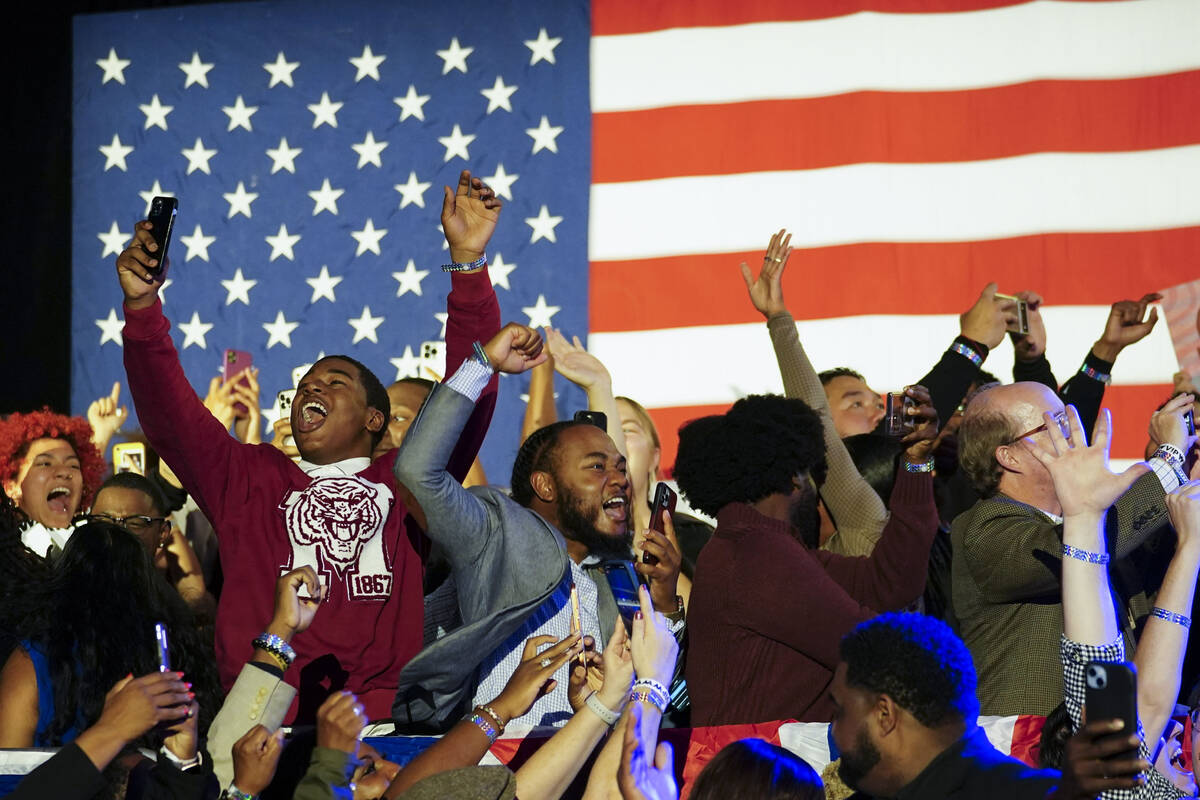Supporters cheer during an election night watch party for Democratic Sen. Raphael Warnock, Tues ...