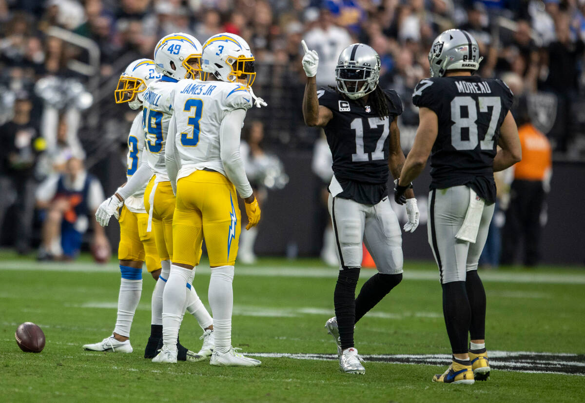 Raiders wide receiver Davante Adams (17) signals for a first down after making a catch during t ...