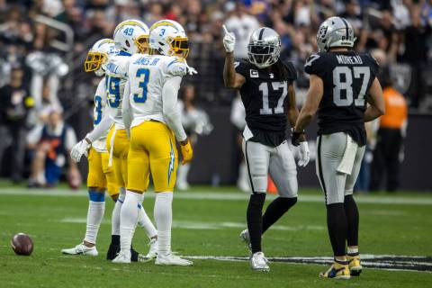 Raiders wide receiver Davante Adams (17) signals for a first down after making a catch during t ...