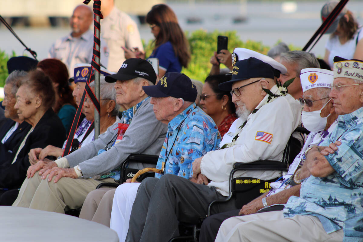Pearl Harbor survivors and other military veterans observe a ceremony on Wednesday, Dec. 7, 202 ...