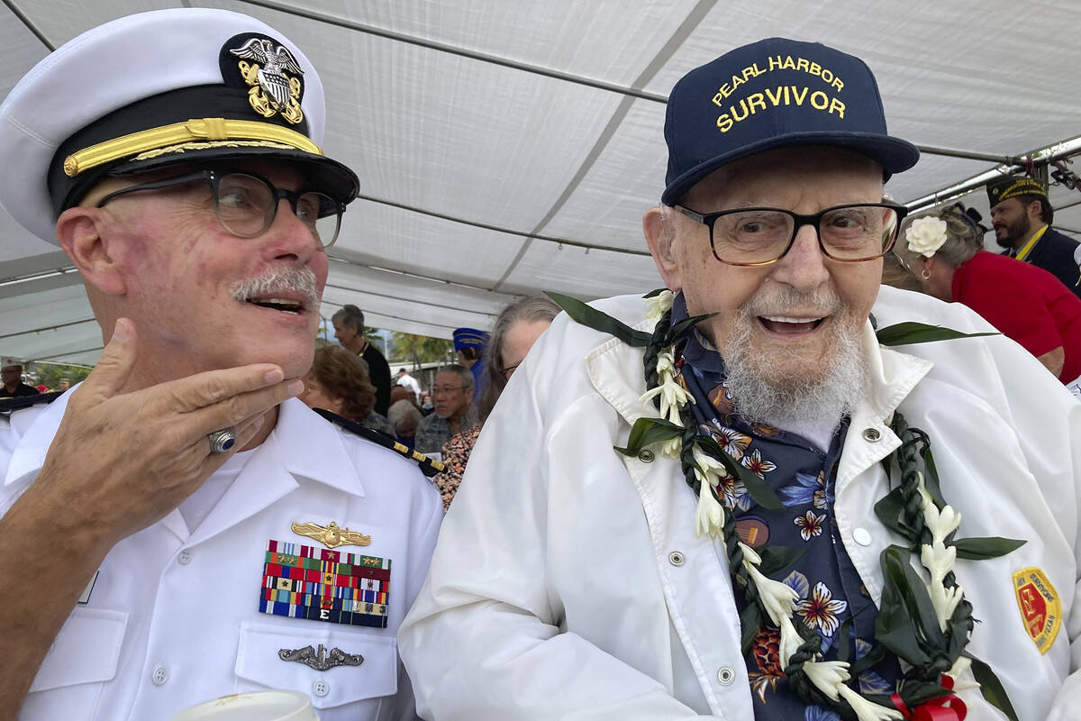 Ira Schab, 102, right, who survived the attack on Pearl Harbor as a sailor on the USS Dobbin, t ...