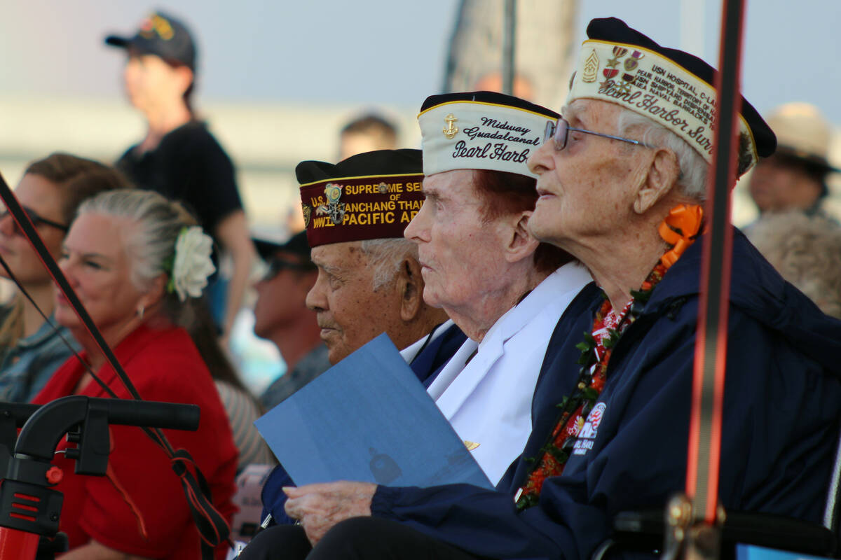 Pearl Harbor survivors and other military veterans observe a ceremony on Wednesday, Dec . 7, 20 ...