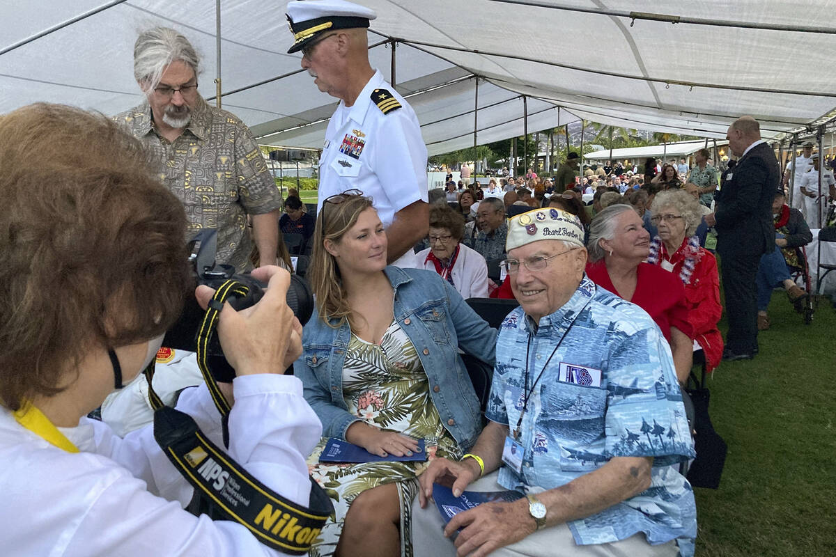 Pearl Harbor survivor Herb Elfring, 100, right, of Jackson, Mich., poses for a photo next to hi ...