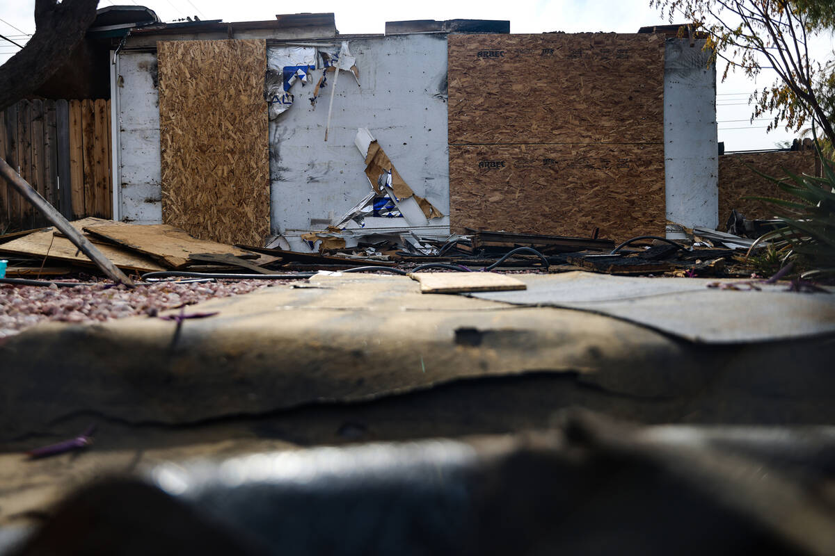 The remains of a house burned by fire at 2116 Hoyt Avenue in Las Vegas on Tuesday, Dec. 6, 2022 ...