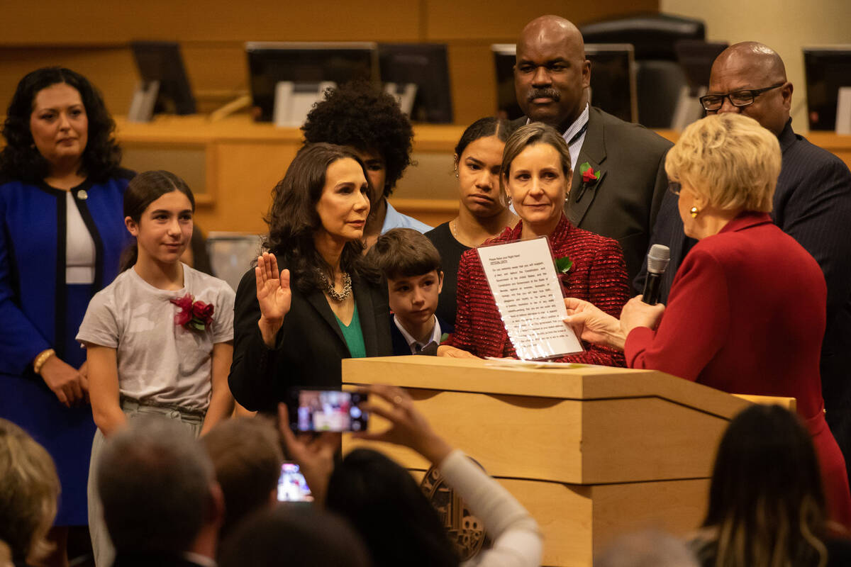Incoming City Councilwoman Nancy Brune is sworn in by Mayor Carolyn Goodman at Las Vegas City H ...