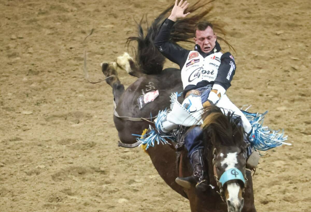 Tim O’Connell, of Zwingle, Iowa, competes in bareback riding during the first night of the Na ...