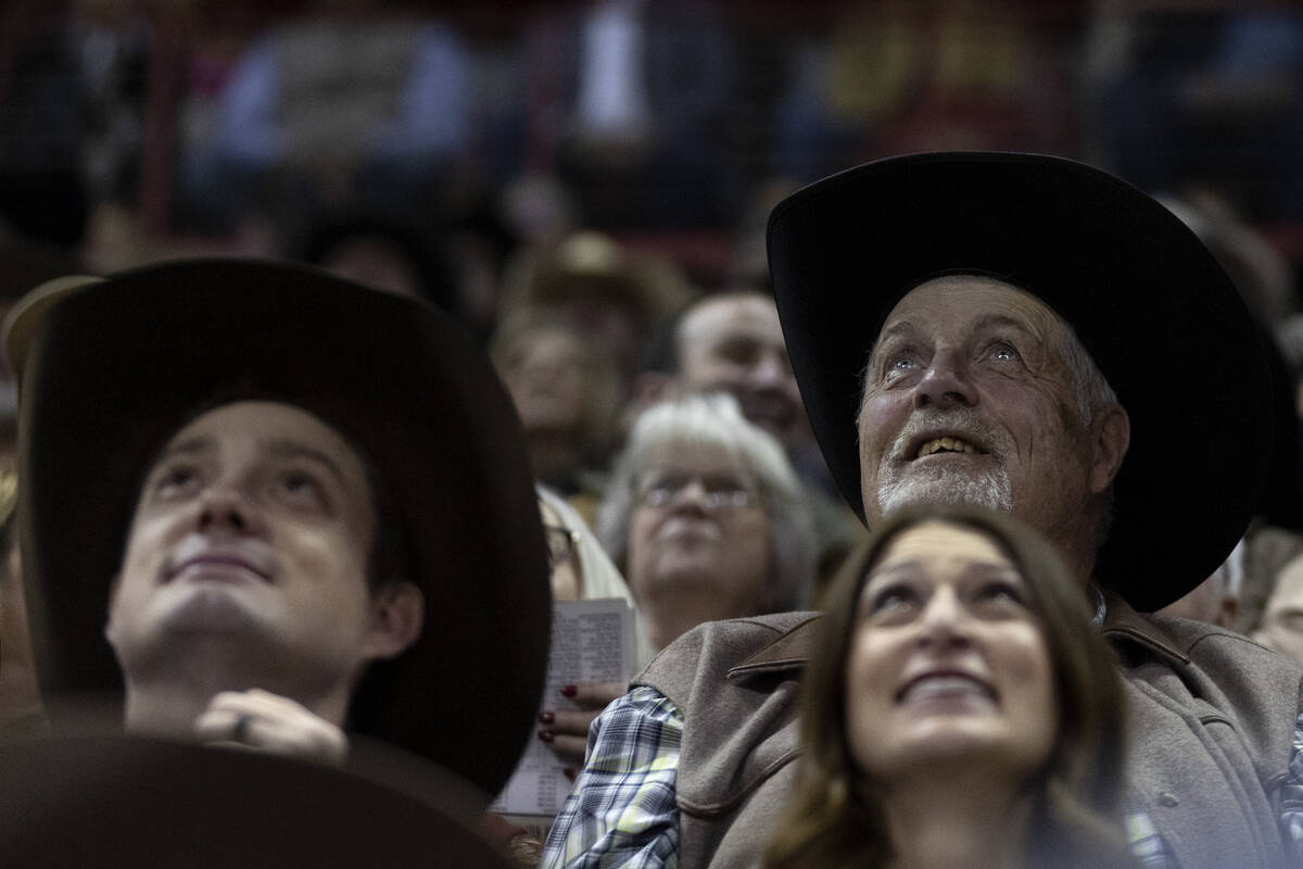 Fans enjoy the entertainment during the eighth go-round of the National Finals Rodeo at the Tho ...