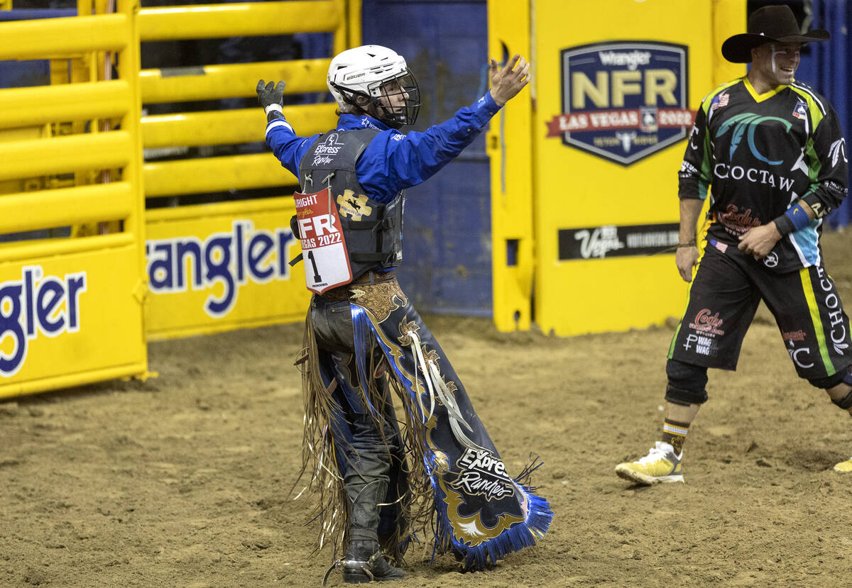 Stetson Wright, of Milford Utah, celebrates after competing in saddle bronc riding during the e ...