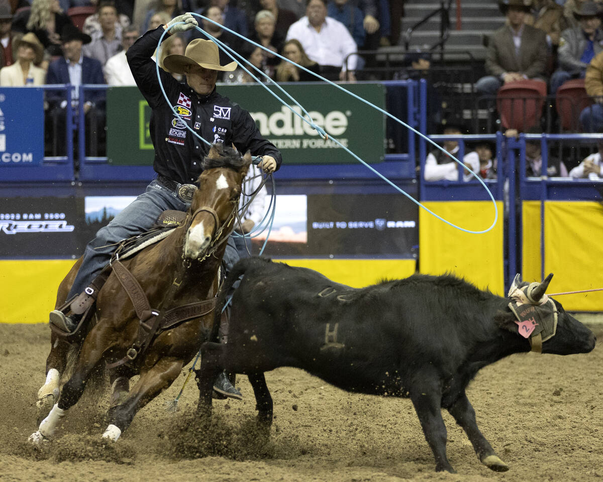 Logan Medlin, of Tatum, N.M., competes in team roping during the eighth go-round of the Nationa ...