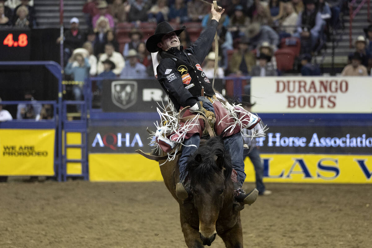 Leighton Berry, of Weatherford, Tex., competes in bareback riding during the eighth go-round of ...