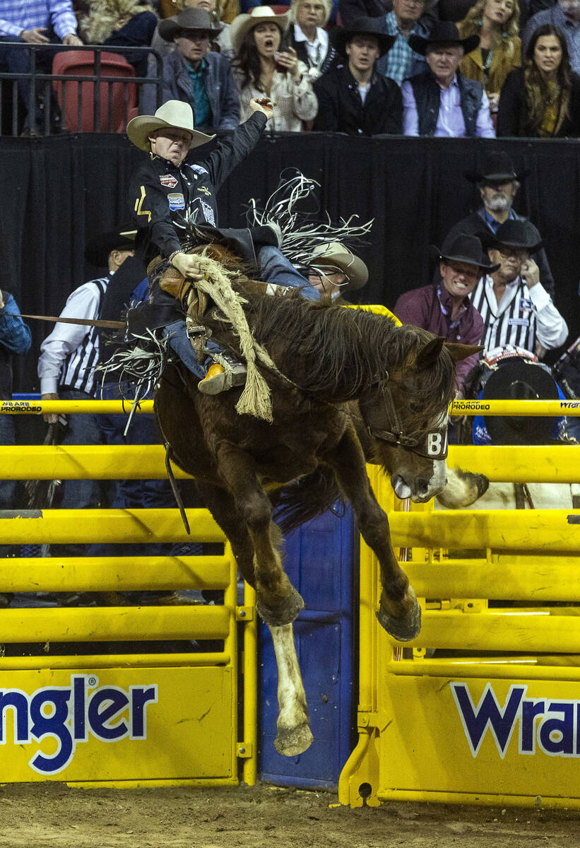 Dawson Hay of Wildwood, Alberta, catches some air on his winning ride in Saddle Bronc Riding du ...