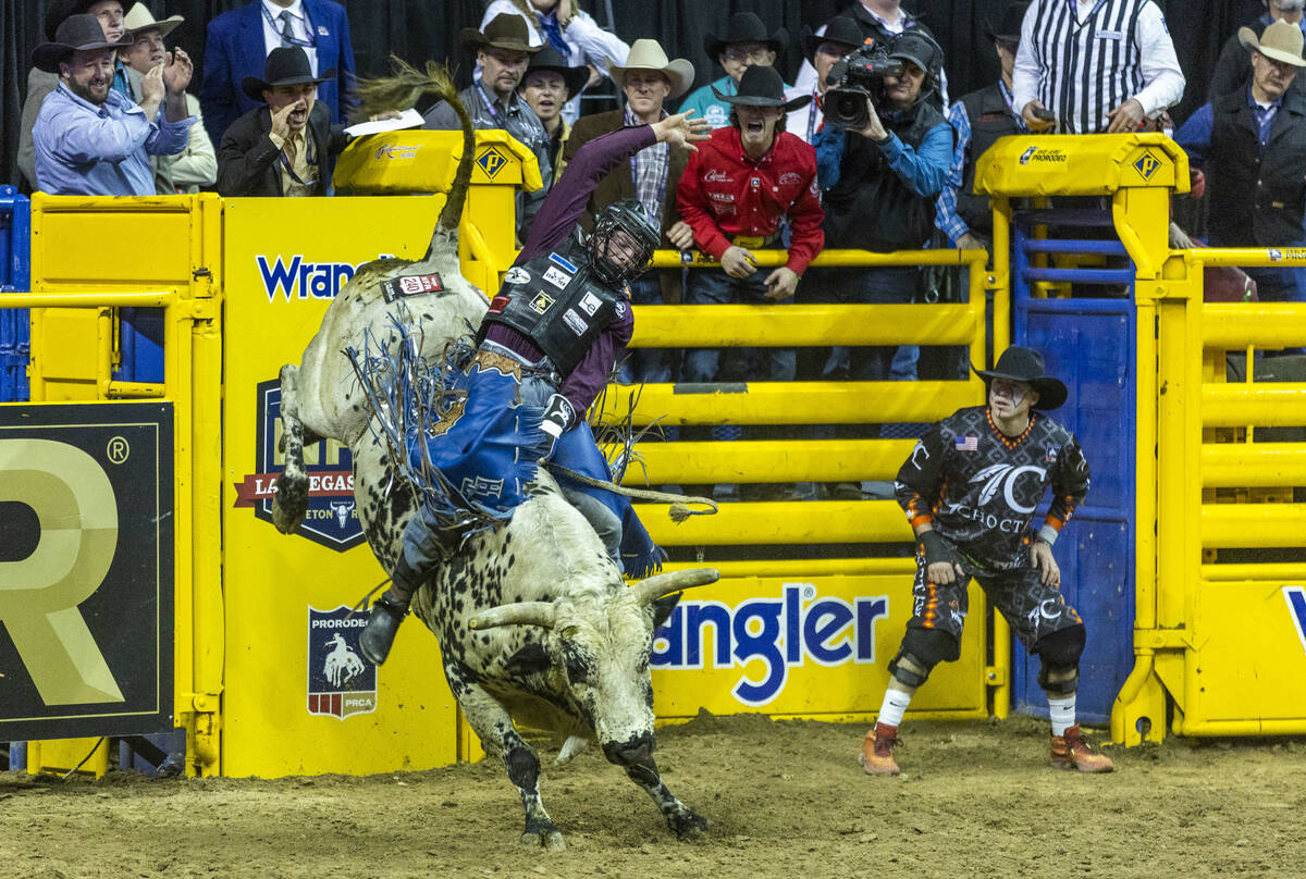 Tristen Hutchings of Monteview, Idaho, hangs tight on his ride in Bull Riding during the Nation ...