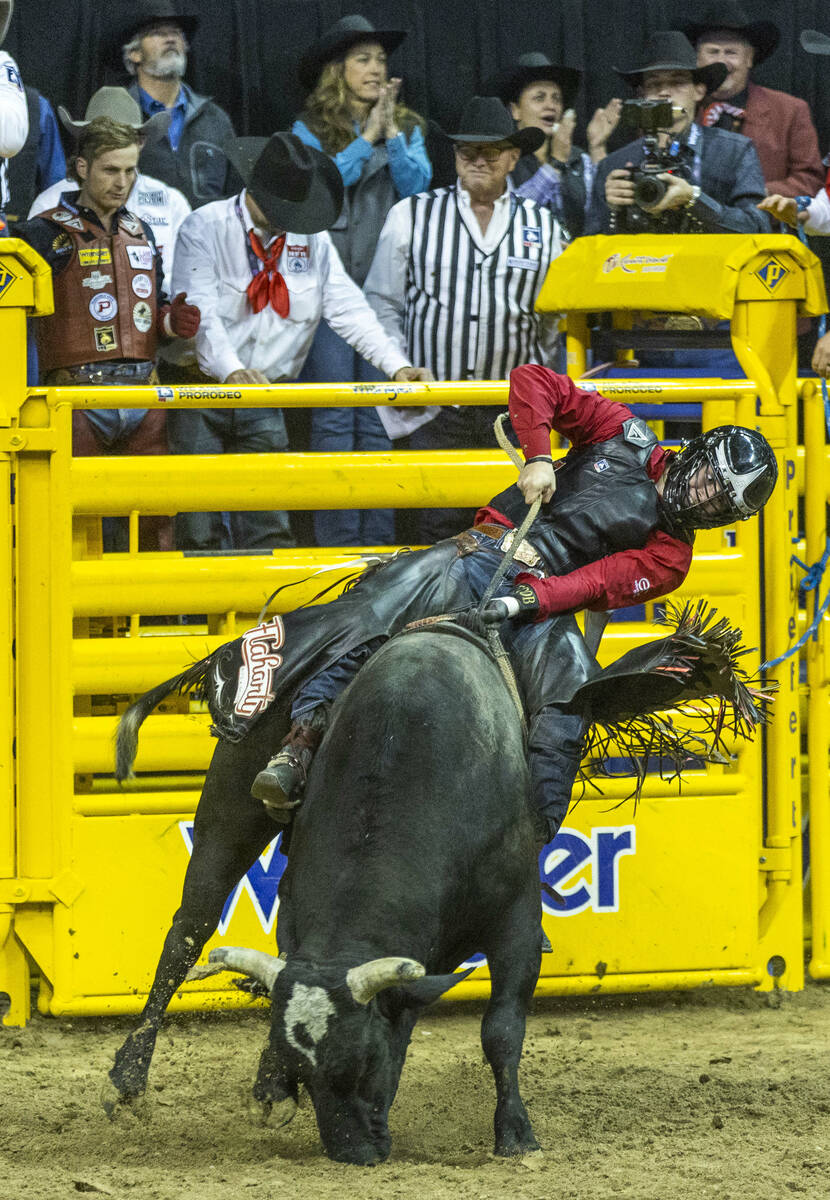 Trey Holston of Fort Scott, Kan., hangs tight on his winning ride in Bull Riding during the Nat ...