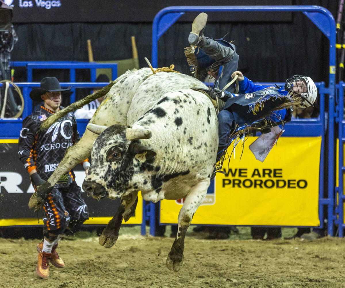 Stetson Wright of Milford, Utah, holds on for time in Bull Riding during the National Finals Ro ...