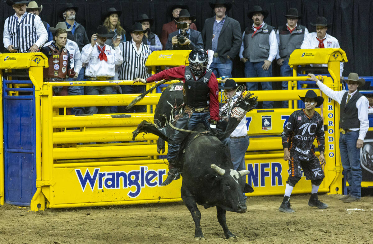Trey Holston of Fort Scott, Kan., hangs tight on his winning ride in Bull Riding during the Nat ...