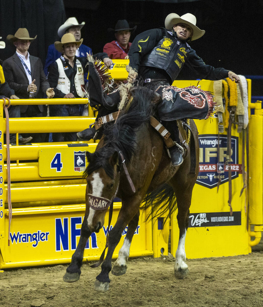 Logan Hay of Wildwood, Alberta, leans back on his ride in Saddle Bronc Riding during the Nation ...