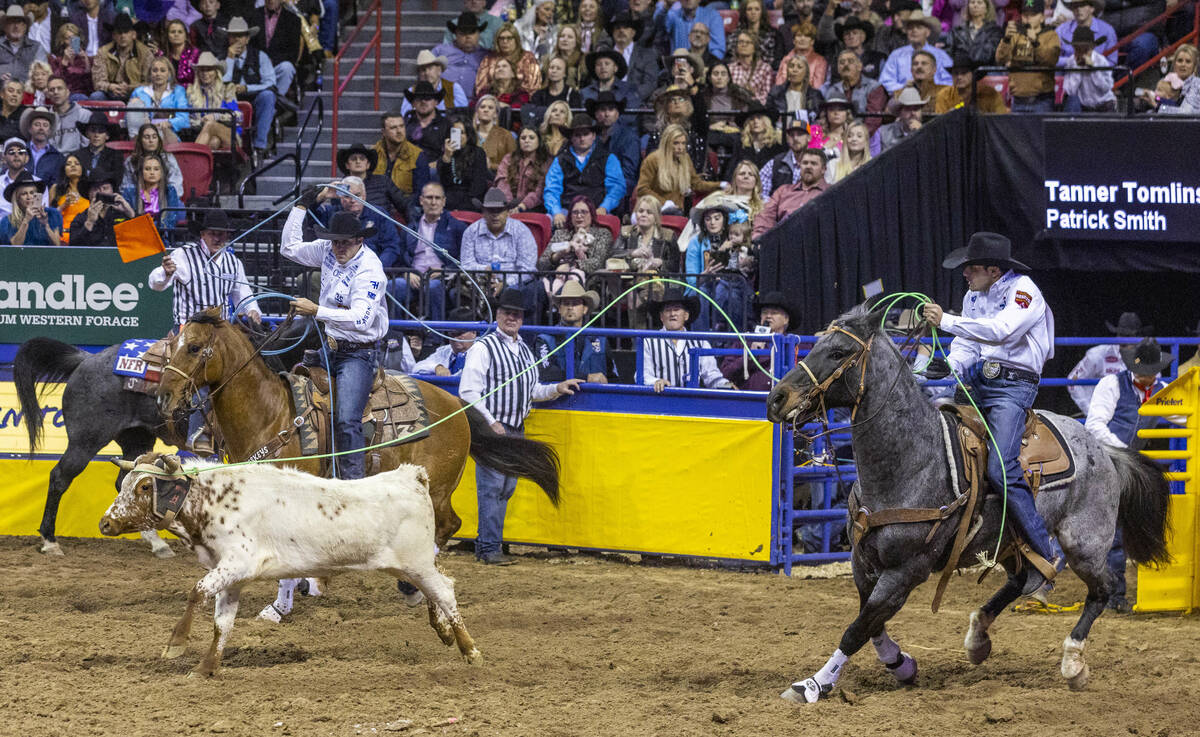 Header Tanner Tomlinson of Angleton, Texas, and Heeler Patrick Smith of Lipan, Texas, rope thei ...
