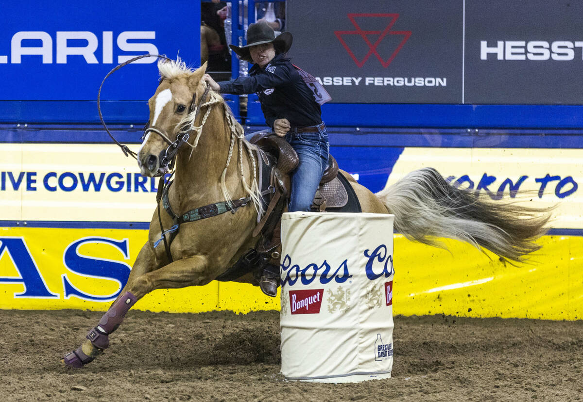 Hailey Kinsel of Cotulla, Texas, navigates a barrel on the way to her winning time in Barrel Ra ...