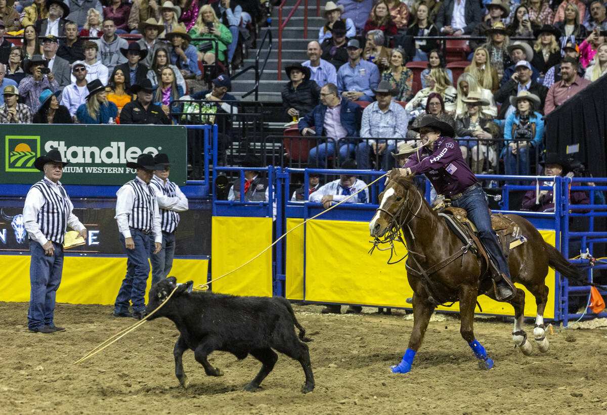 Marty Yates of Stephenville, Texas, ropes his calf on the way to a winning time in Tie-Down Rop ...