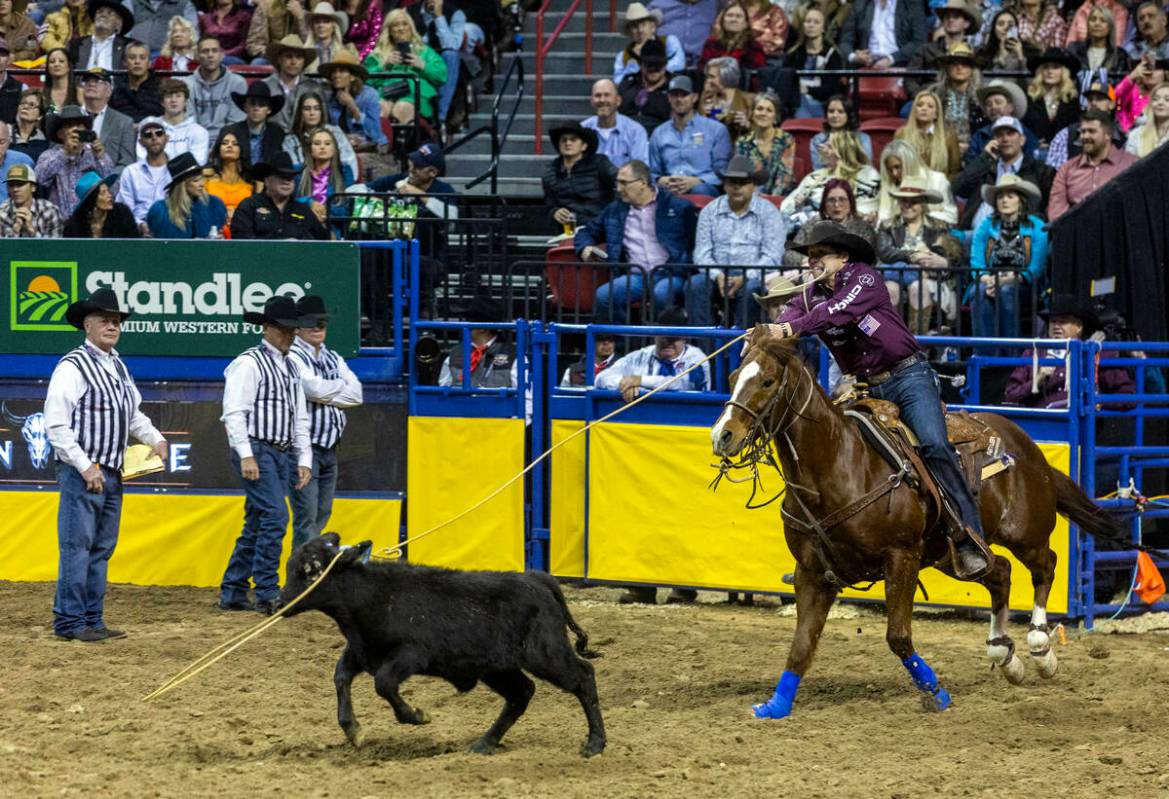 Marty Yates of Stephenville, Texas, ropes his calf on the way to a winning time in Tie-Down Rop ...