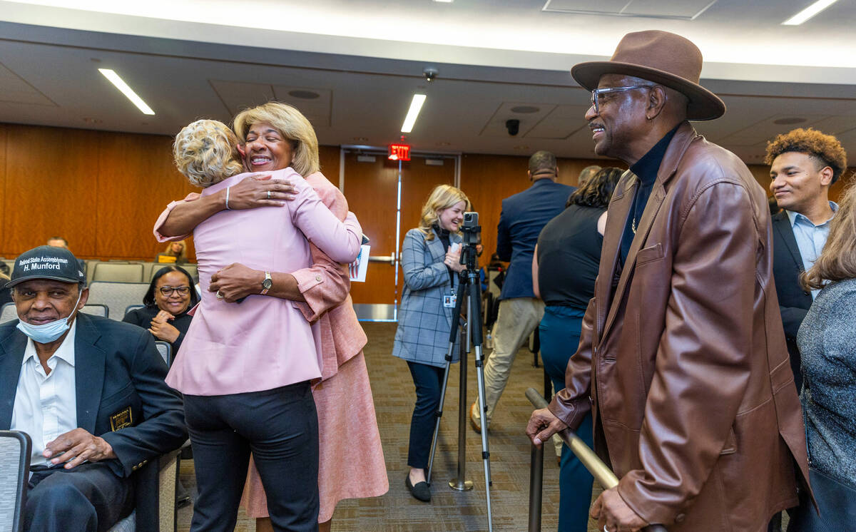 North Las Vegas Mayor Pamela Goynes-Brown receives a hug as husband Romero Brown, right, looks ...