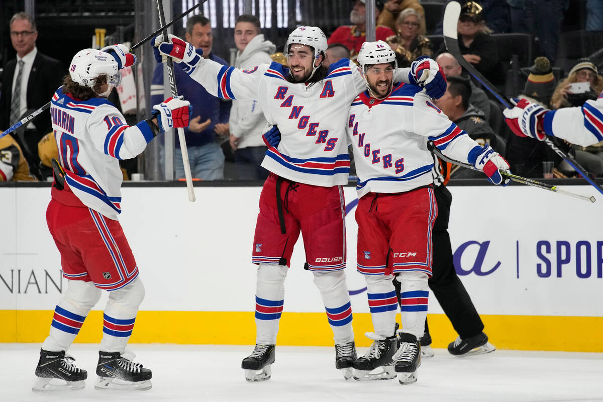 New York Rangers center Mika Zibanejad, center, celebrates after scoring against the Vegas Gold ...