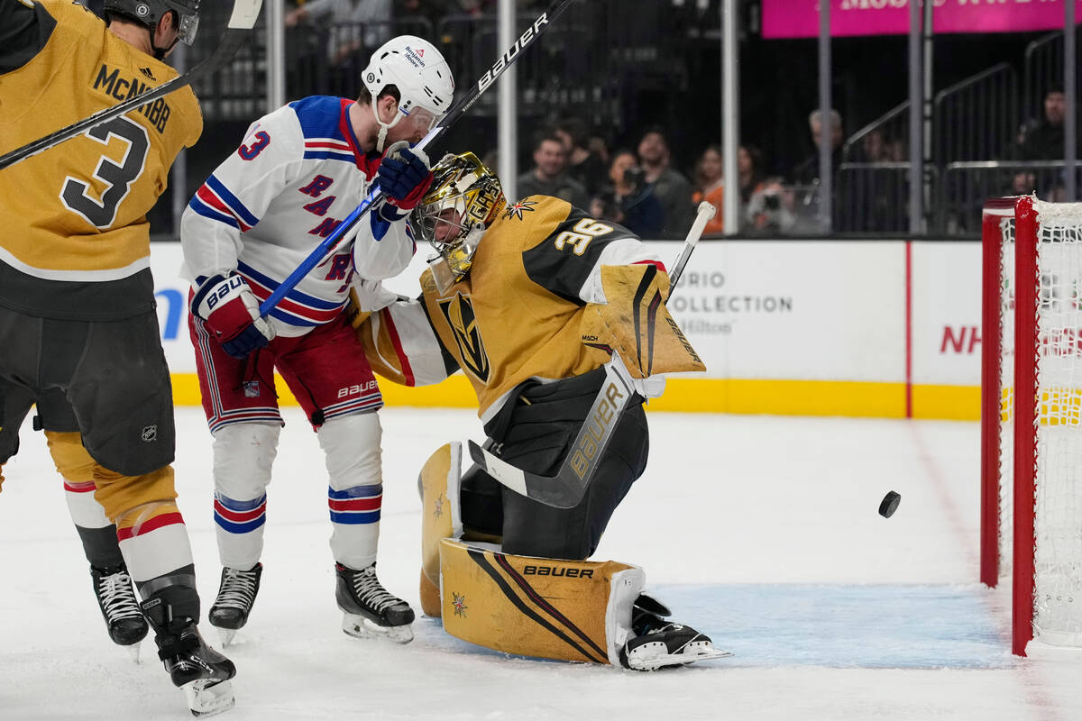 New York Rangers left wing Alexis Lafrenière (13) watches as a shot by New York Rangers ri ...