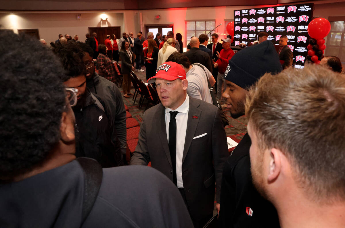 New UNLV football coach Barry Odom greets his players after being introduced at a news conferen ...