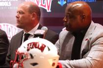 New UNLV football coach Barry Odom, center, is introduced with President Keith Whitfield, left, ...