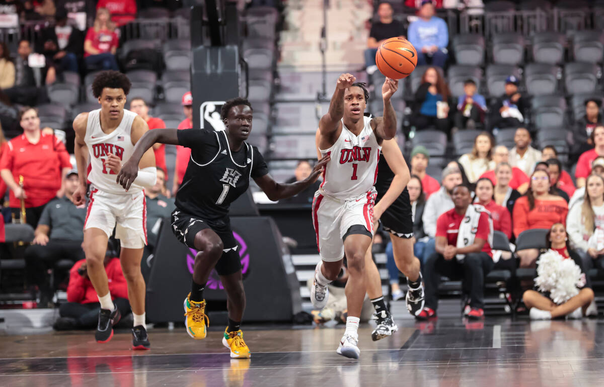 UNLV Rebels guard Elijah Parquet (1) passes the ball during the first half of a basketball game ...