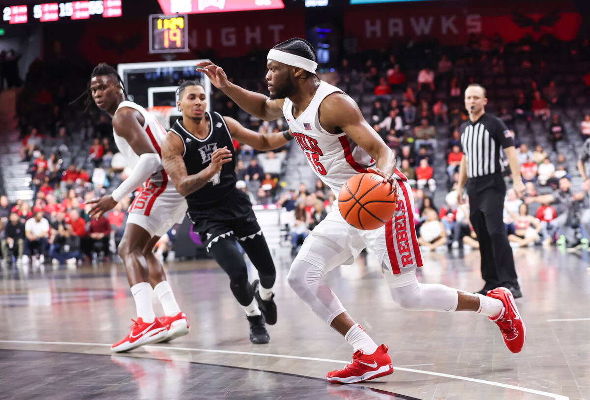 UNLV Rebels guard EJ Harkless (55) drives the ball against Hawaii during the second half of a b ...