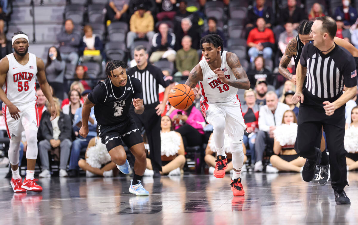 UNLV Rebels guard Keshon Gilbert (10) brings the ball up court against Hawaii Warriors guard Jo ...