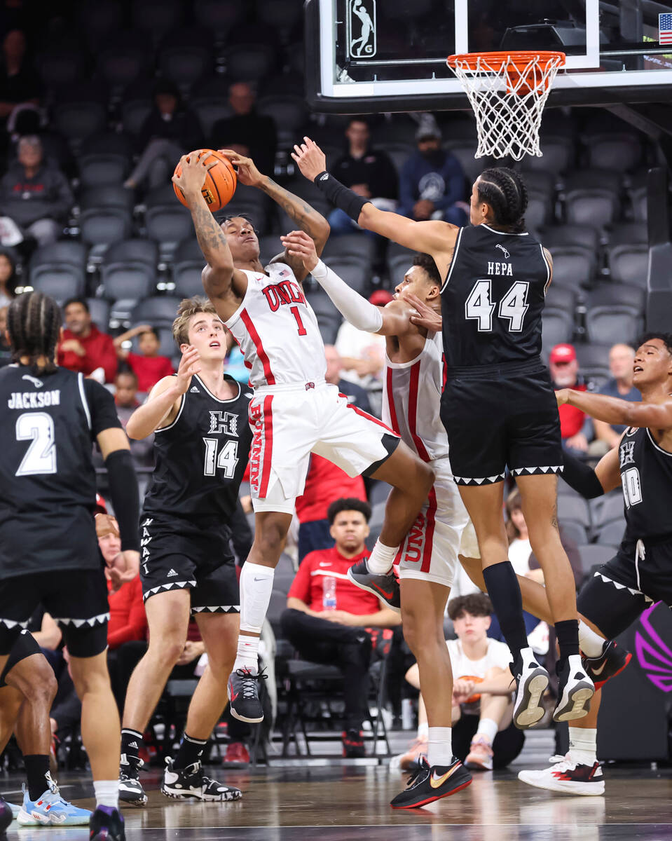 UNLV Rebels guard Elijah Parquet (1) grabs the rebound against Hawaii Warriors forward Kamaka H ...