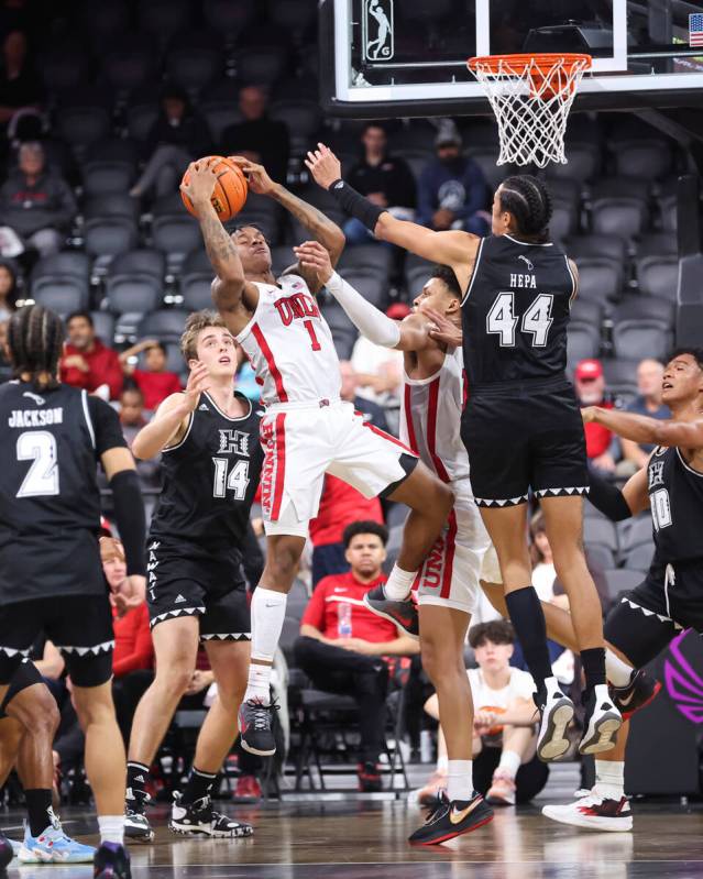 UNLV Rebels guard Elijah Parquet (1) grabs the rebound against Hawaii Warriors forward Kamaka H ...
