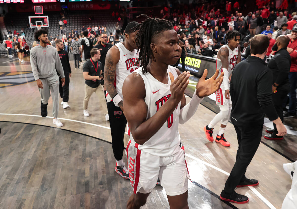 UNLV Rebels forward Victor Iwuakor (0) cheers after defeating Hawaii in a basketball game at th ...