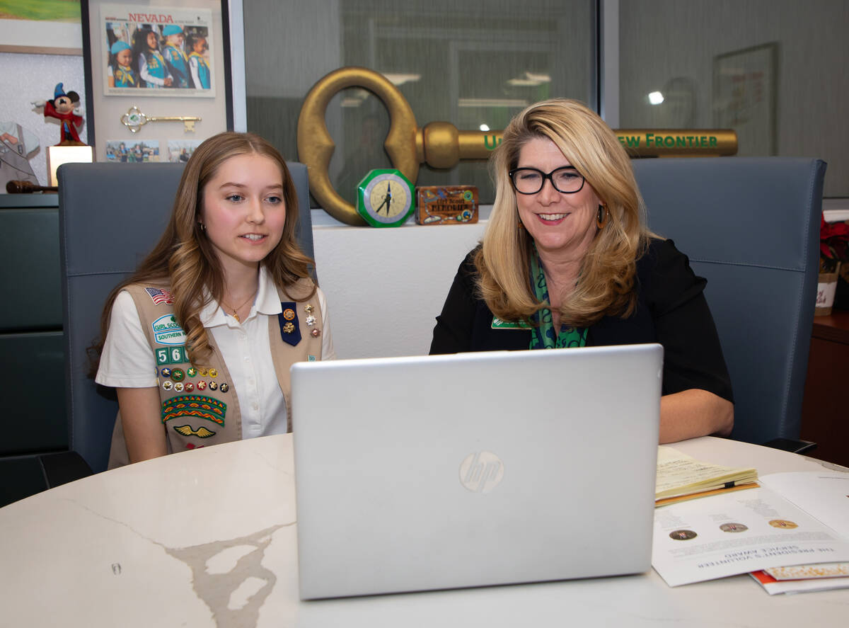 Anna Newcomer, a UNLV freshman and Girl Scout lifetime member of Troop 566, left, and Girl Scou ...
