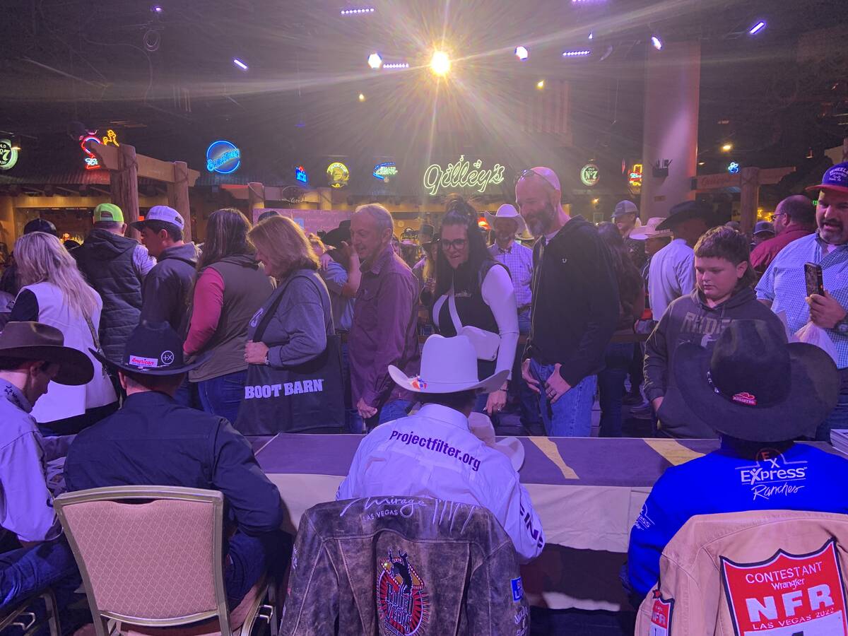 A full house of rodeo fans queued up at Gilley's on Thursday for the Wrangler NFR bull riders a ...
