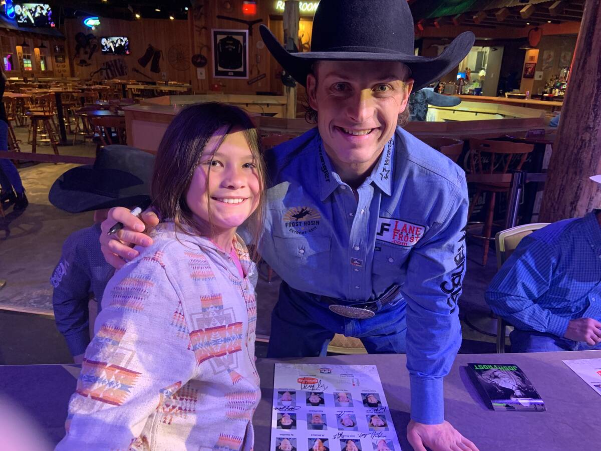 Jessie James Jensen, left, an 11-year-old rodeo fan from Boulder, Wyo., was all smiles while ge ...